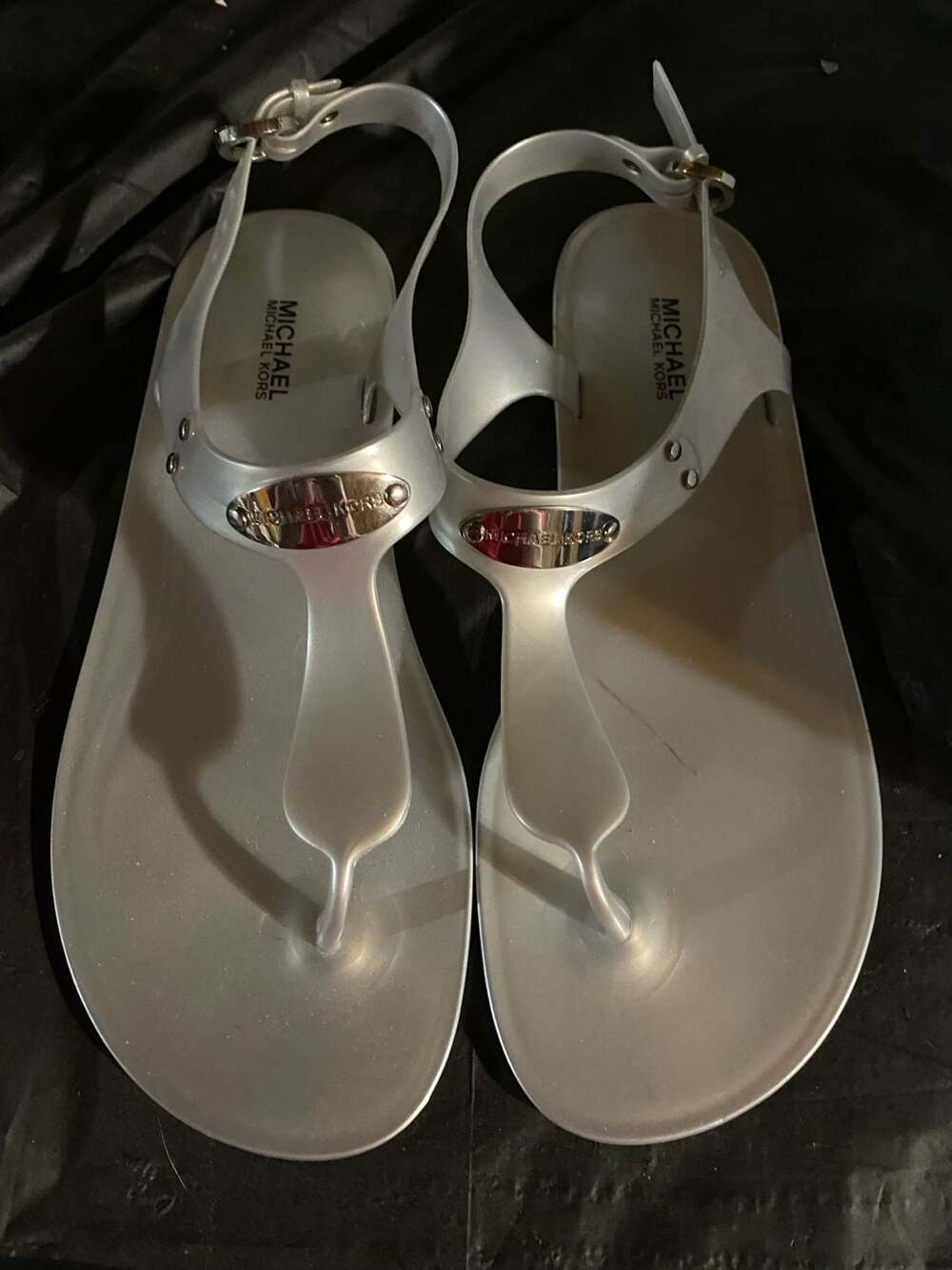 Michael Kors Jelly Thong Sandal Size 8M Silver PVC Logo Plate